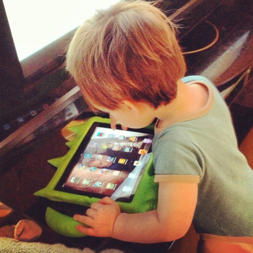 Roo at about 20 months old playing with 'his' iPad!