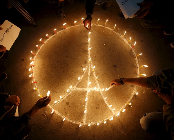 People light candles during a vigil in Kathmandu November 15, 2015, following the deadly attacks in Paris. REUTERS/Navesh Chitrakar - RTS75NH